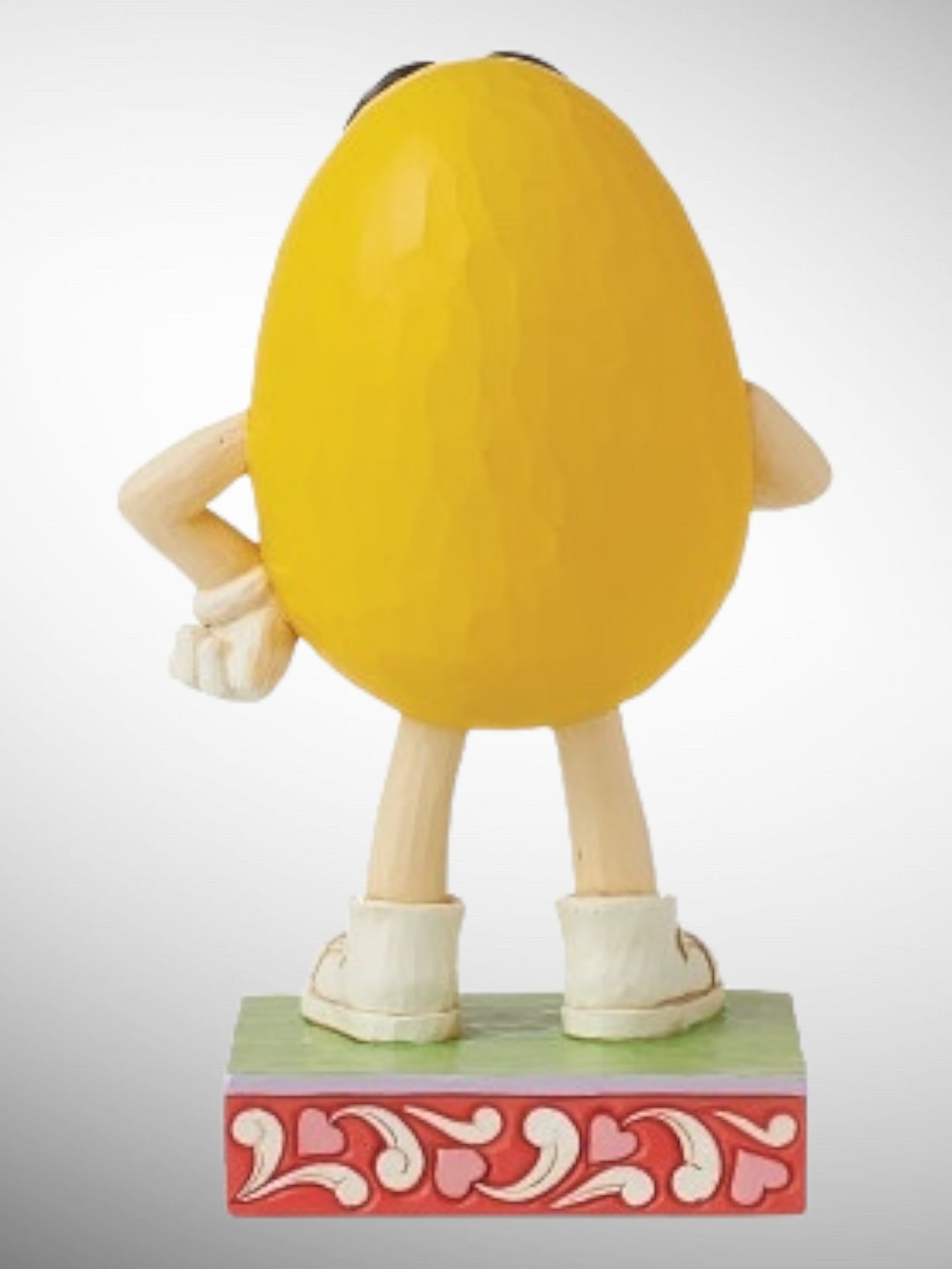 Jim Shore M&M's Collection - Is There Something On My Face? Yellow Kisses Figurine - PREORDER