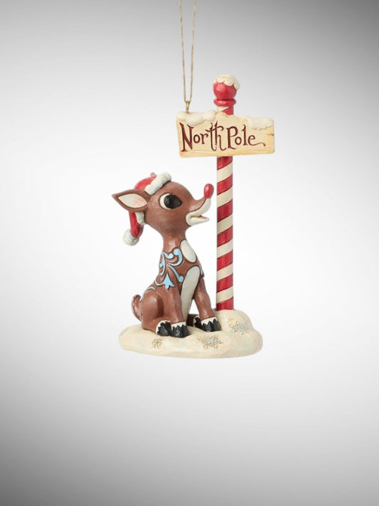 Jim Shore Rudolph Traditions - Rudolph by North Pole Sign Hanging Ornament - PREORDER