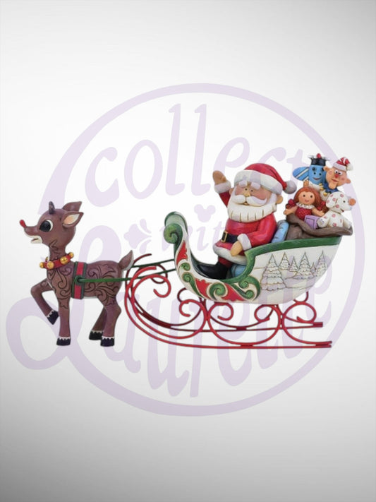 Jim Shore Rudolph Traditions - Rudolph Pulling Santa in Sled Figurine - PREORDER