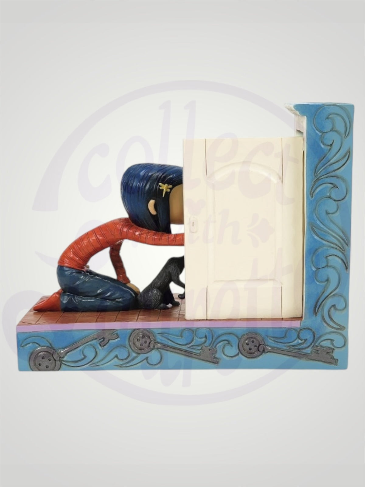 Jim Shore Coraline - Through the Keyhole Coraline with Secret Door Figurine - PREORDER