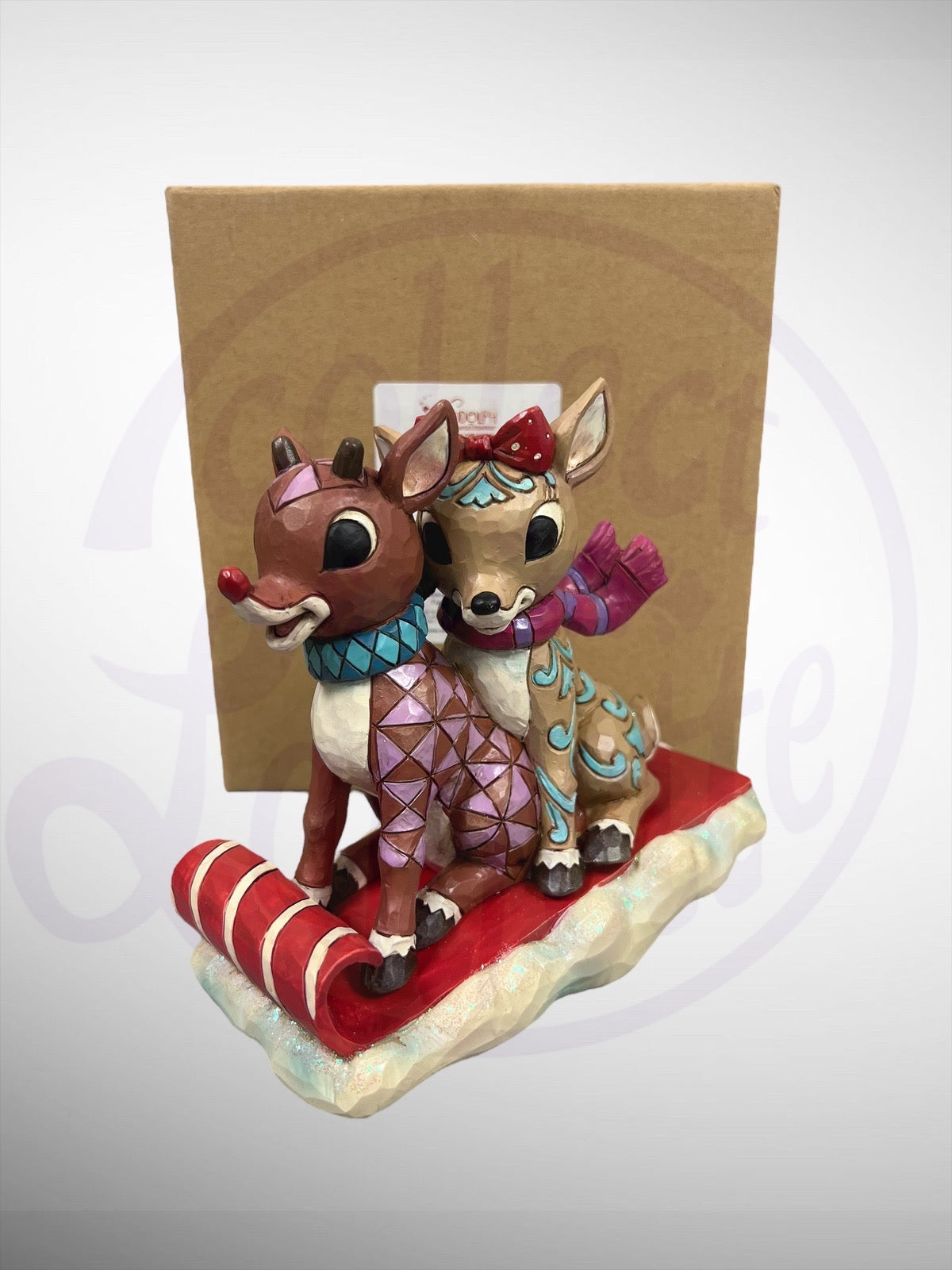 Jim Shore Rudolph Traditions - Rudolph & Clarice on Toboggan Figurine