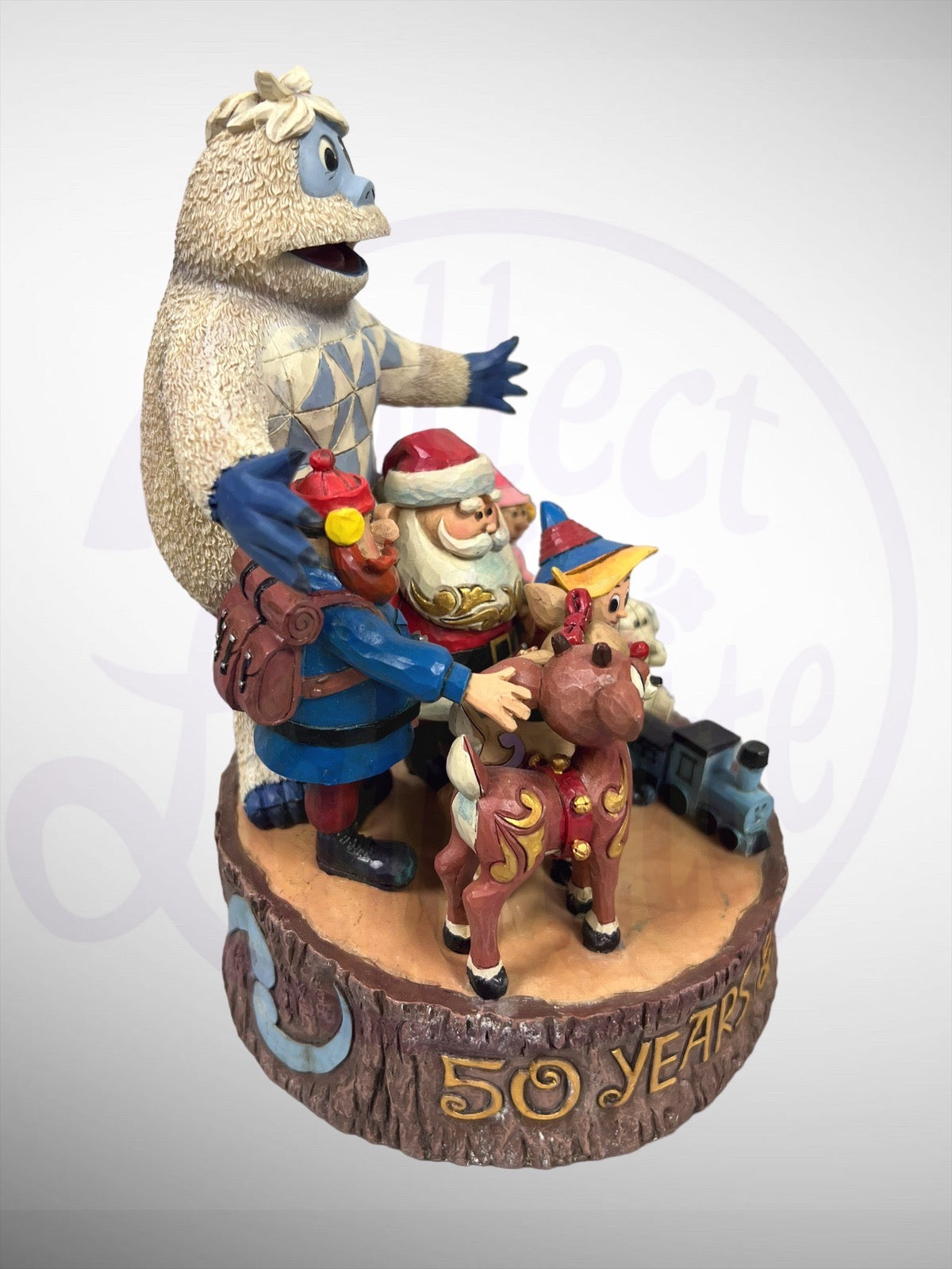 Jim Shore Rudolph Traditions - 50 Years and Still Glowing Anniversary Carved By Heart Figurine