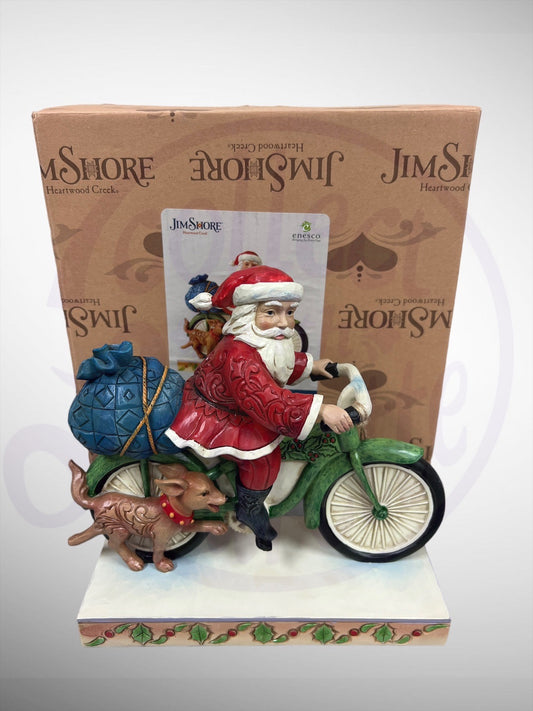 Jim Shore Heartwood Creek - Santa's On His Way Santa Claus on Bicycle Figurine